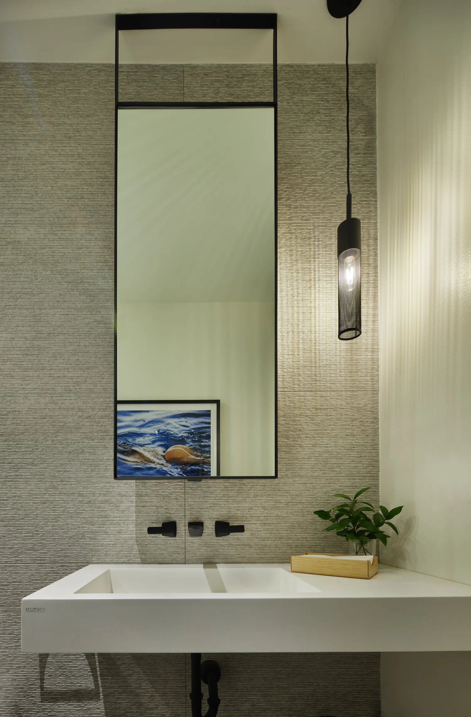 Powder room — textured wall tile, pendant lighting, floating vanity